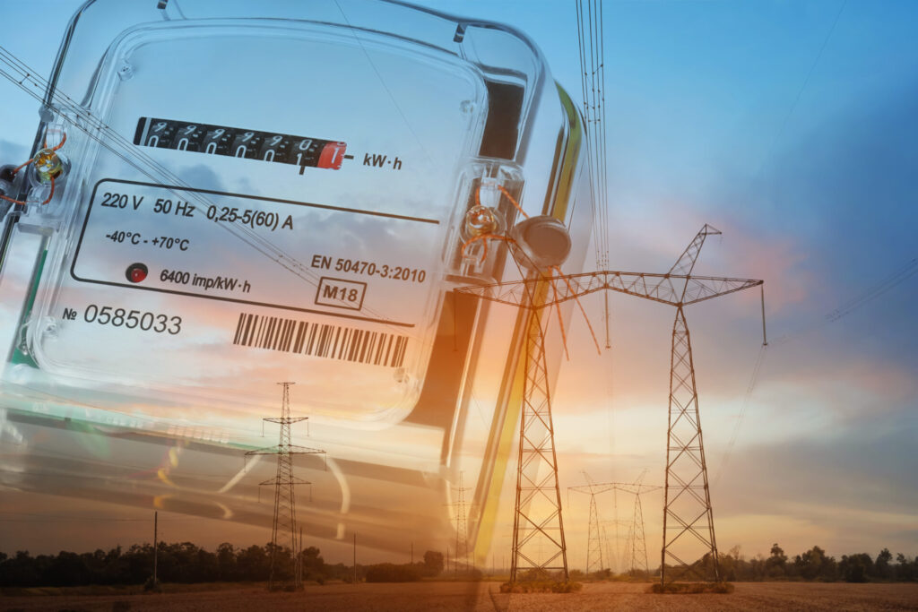 Double exposure of electricity meter and high voltage towers with transmission power lines © AdobeStock_ID 505852528